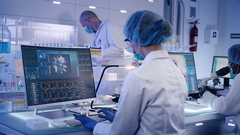 Research scientists working in a lab on a COVID vaccine