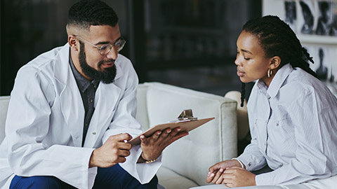 Image of a person consulting with a doctor.