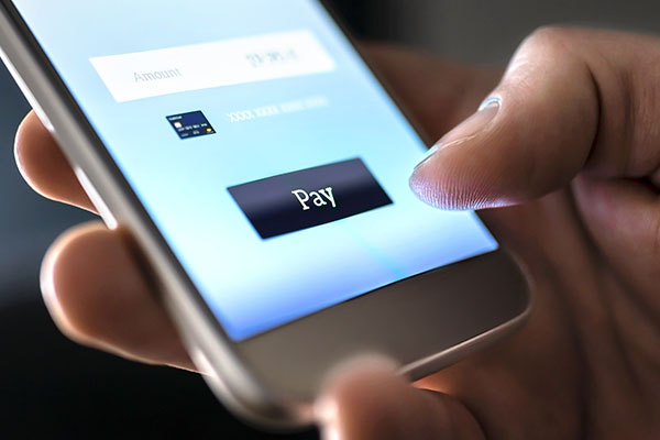 Close up of smartphone with user making an electronic payment