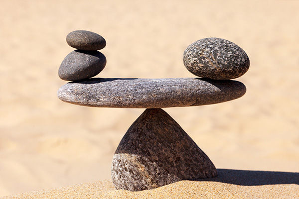 Rocks balanced one on top of another on the beach 