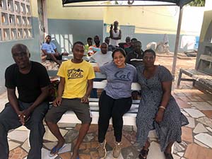 Four people sitting on a bench