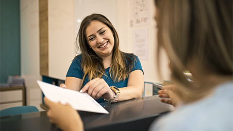 A practitioner setting up an appointment with their client.