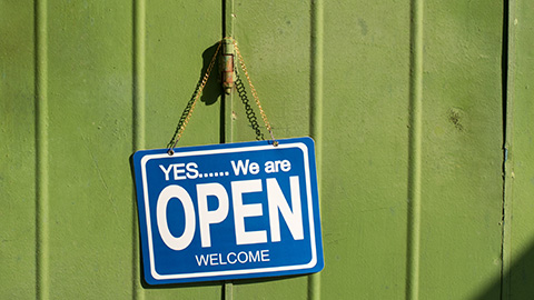 An open sign on the door of a business