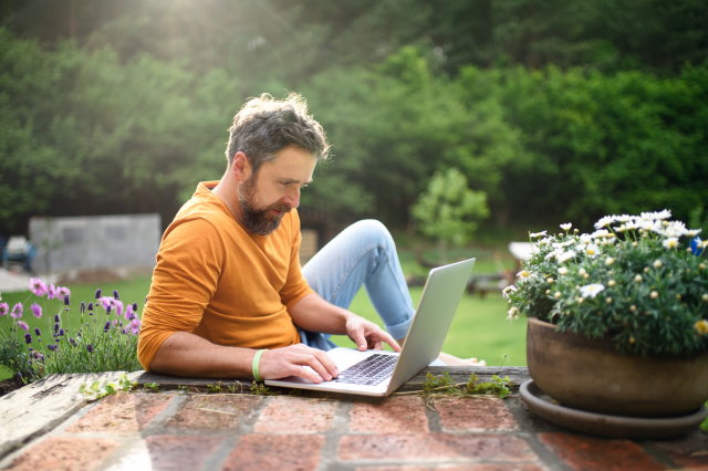 man working on a laptop computer