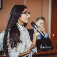 woman holding a microphone