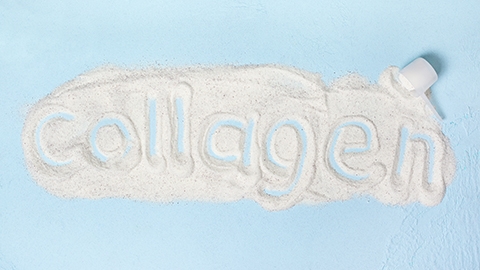 blue background with collagen powder close up.