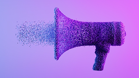 Megaphone exploding with particles on neon background. Digitally generated image.