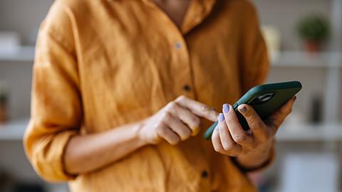 Image of a person using a cell phone.